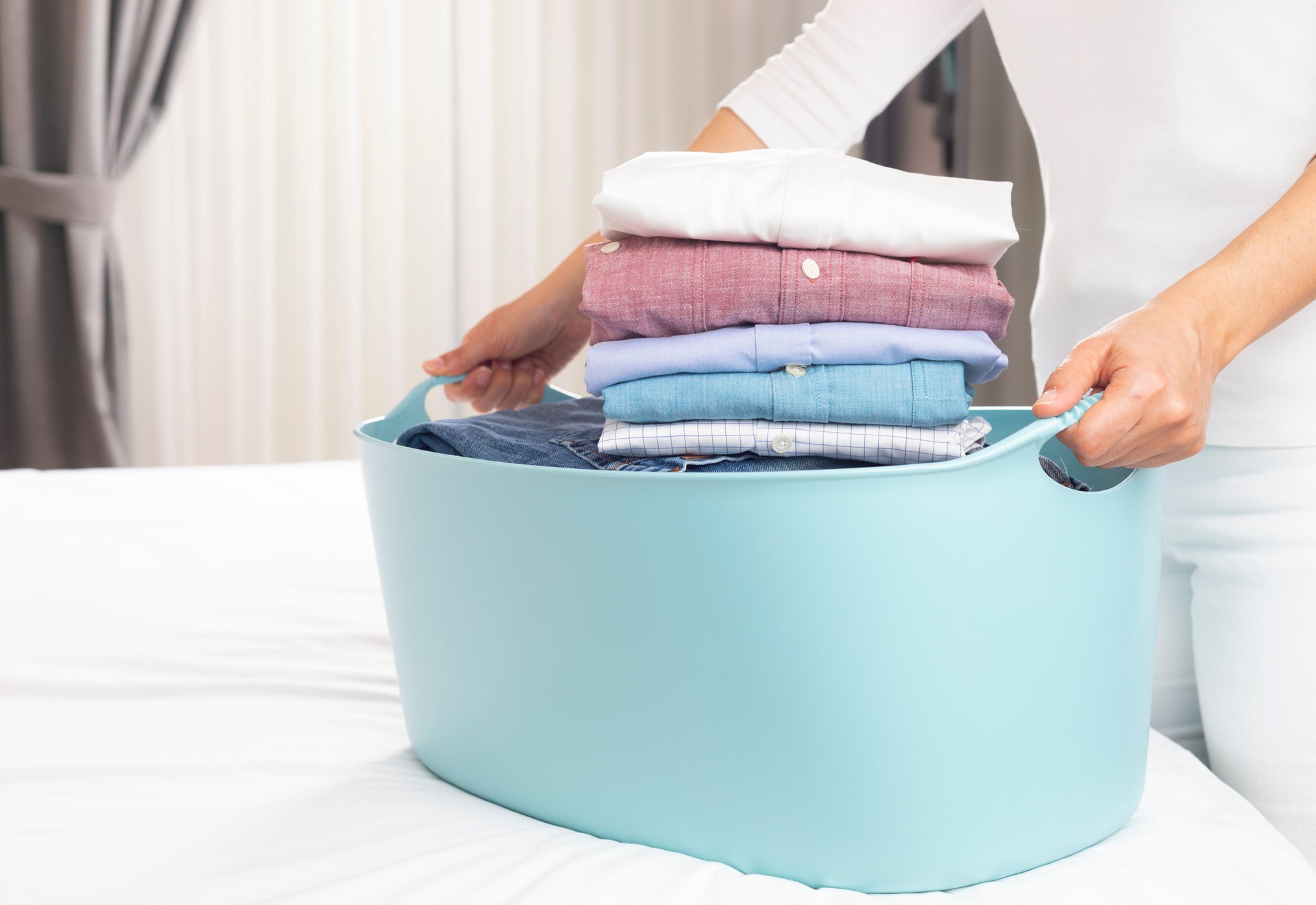 Laundry Basket with Folded Shirts